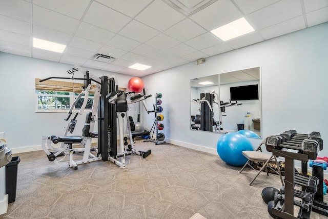 gym with visible vents, carpet flooring, a paneled ceiling, and baseboards