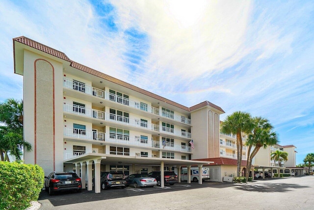 view of property featuring covered parking