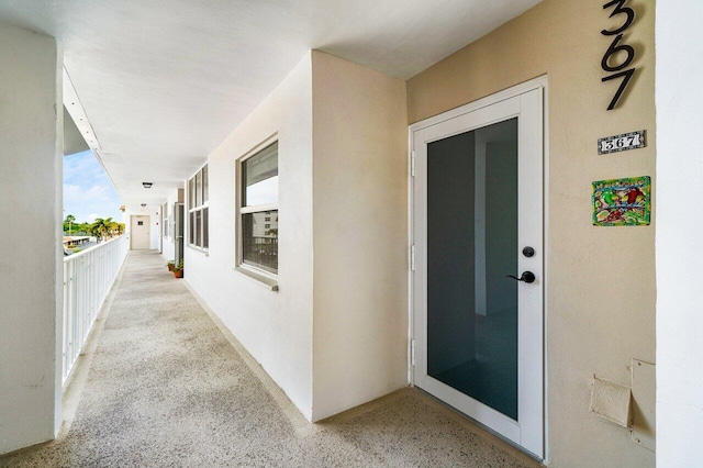 entrance to property with stucco siding