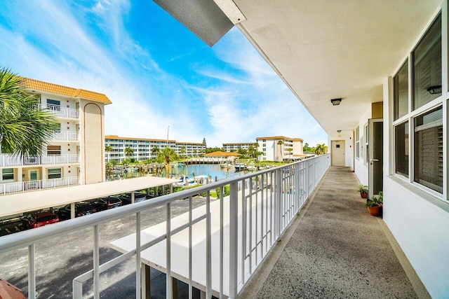 balcony featuring a water view