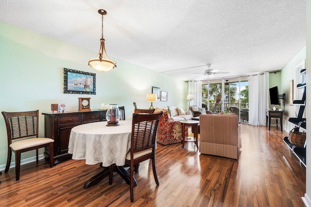 dining space featuring a ceiling fan, wood finished floors, baseboards, and a textured ceiling