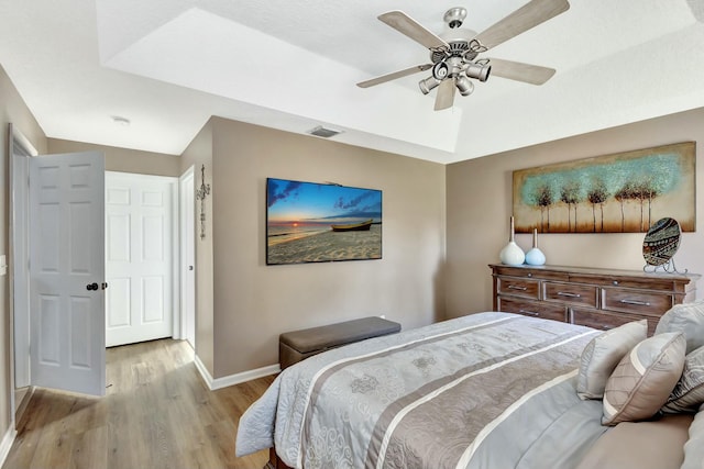 14618 66th St N, Loxahatchee, FL 33470 - bedroom with baseboards, visible vents, light wood-style floors, and ceiling fan