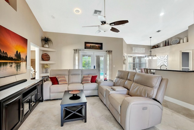 14618 66th St N, Loxahatchee, FL 33470 - living area with baseboards, visible vents, light tile patterned floors, and ceiling fan with notable chandelier