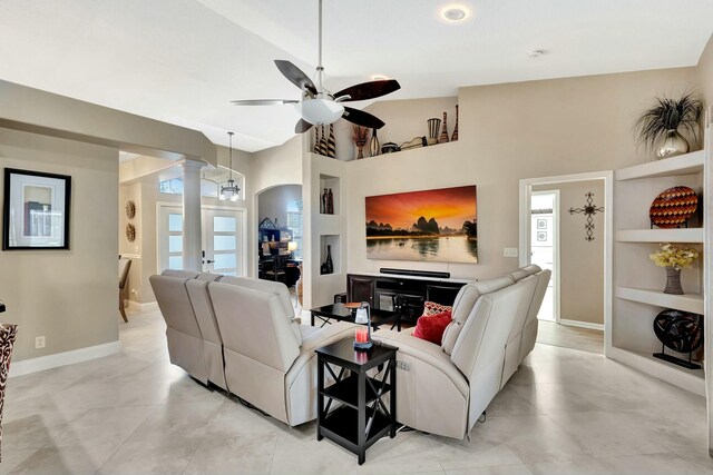 14618 66th St N, Loxahatchee, FL 33470 - living area with a wealth of natural light, baseboards, ceiling fan, and decorative columns