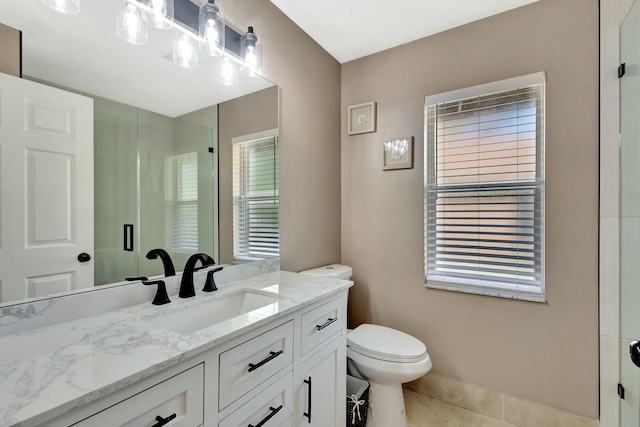 14618 66th St N, Loxahatchee, FL 33470 - bathroom featuring toilet, vanity, tile patterned floors, and a stall shower