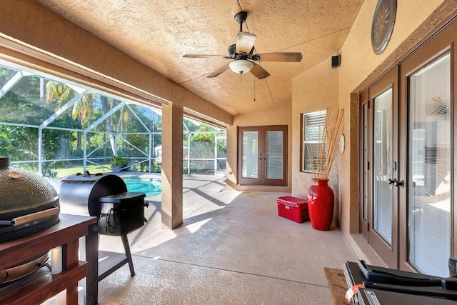 sunroom with a swimming pool, french doors, lofted ceiling, and ceiling fan