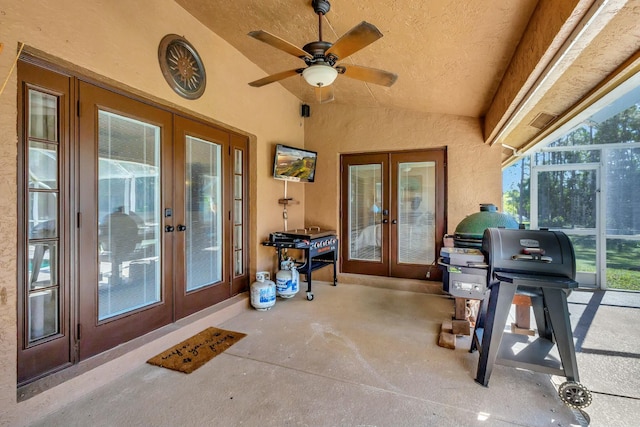 view of patio / terrace featuring a ceiling fan, a lanai, french doors, and a grill