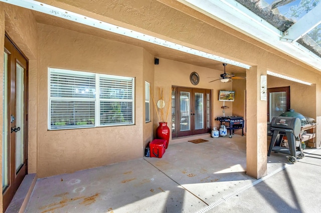 view of patio / terrace with area for grilling, french doors, and ceiling fan