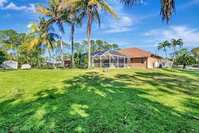 14618 66th St N, Loxahatchee, FL 33470 - view of yard with a lanai, an outbuilding, and a storage unit