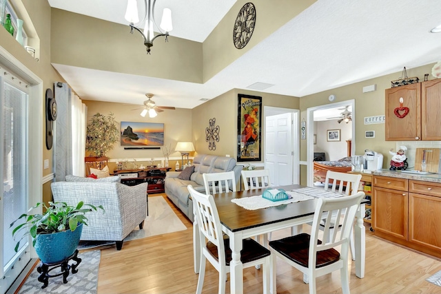 dining space with light wood-style flooring and a ceiling fan