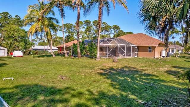 view of yard with a lanai