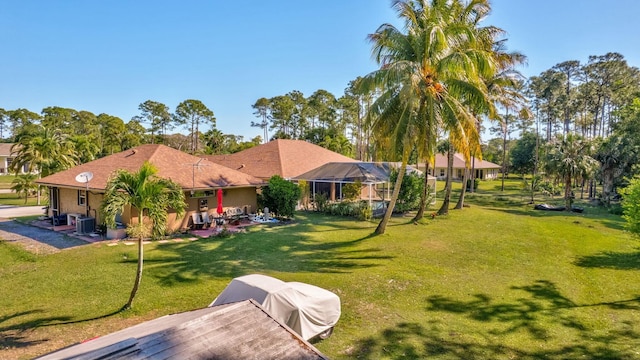 14618 66th St N, Loxahatchee, FL 33470 - exterior space featuring a patio area, a yard, and stucco siding