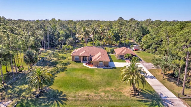 aerial view featuring a wooded view