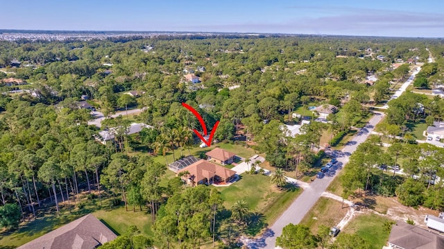 bird's eye view featuring a forest view