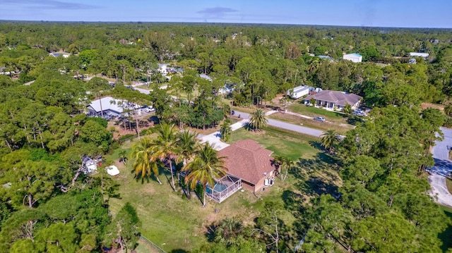 drone / aerial view featuring a view of trees