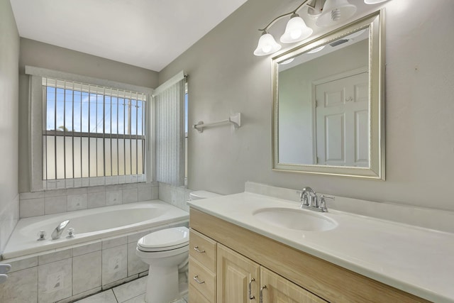 5489 NW Evanston Ave, Port Saint Lucie, FL 34983 - full bathroom with vanity, toilet, tiled tub, and tile patterned flooring