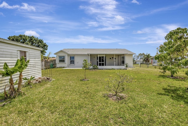 5489 NW Evanston Ave, Port Saint Lucie, FL 34983 - rear view of house with a sunroom and stucco siding