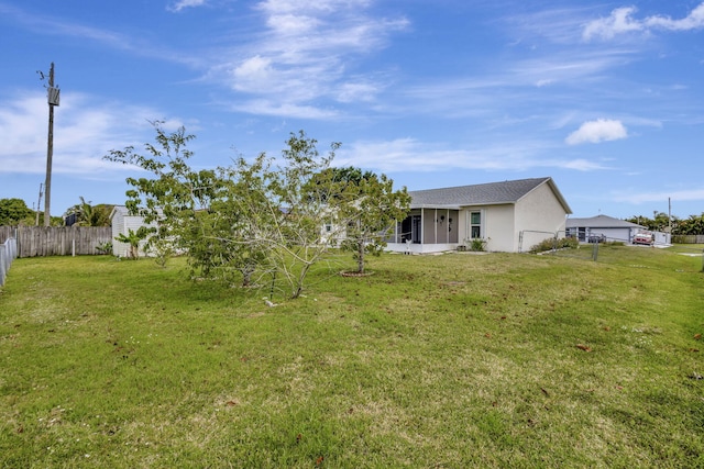 5489 NW Evanston Ave, Port Saint Lucie, FL 34983 - view of yard featuring a sunroom