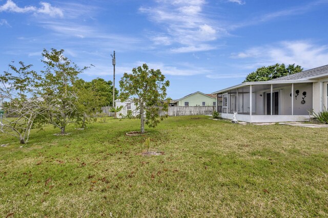 5489 NW Evanston Ave, Port Saint Lucie, FL 34983 - view of yard featuring a sunroom