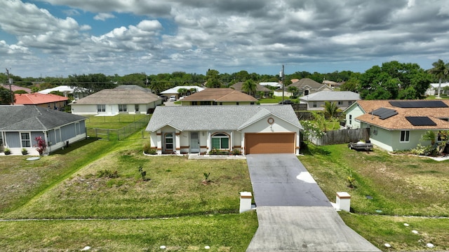 5489 NW Evanston Ave, Port Saint Lucie, FL 34983 - ranch-style house featuring a residential view, driveway, a garage, and a shingled roof