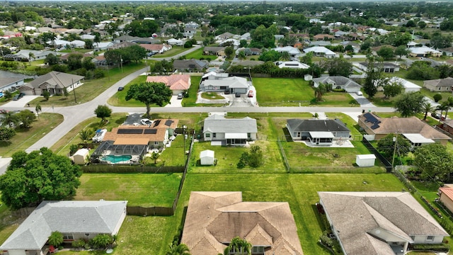 5489 NW Evanston Ave, Port Saint Lucie, FL 34983 - aerial perspective of suburban area with a pool