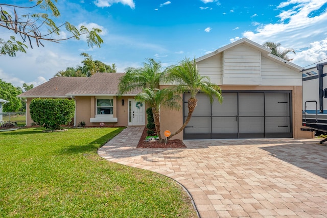 ranch-style house with stucco siding, an attached garage, decorative driveway, and a front yard