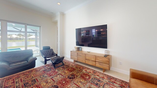 living area with crown molding and baseboards