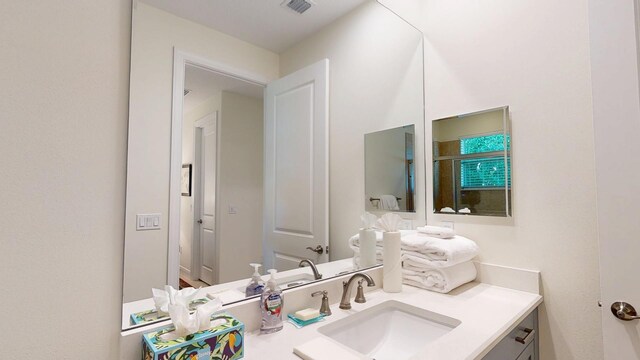 bathroom with visible vents and vanity