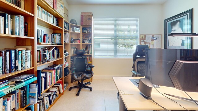 home office with tile patterned floors and baseboards