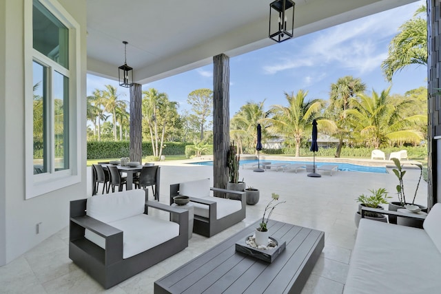 view of patio with outdoor dining space, an outdoor pool, and outdoor lounge area