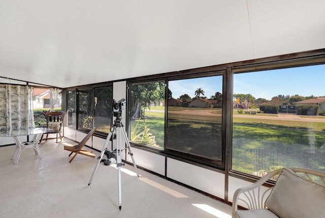 sunroom / solarium featuring a healthy amount of sunlight