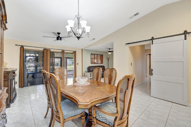 dining area with visible vents, lofted ceiling, a barn door, light tile patterned floors, and ceiling fan with notable chandelier