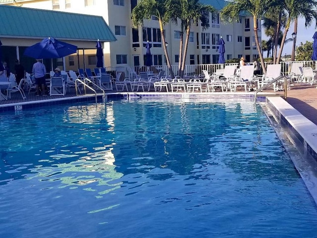 view of swimming pool with fence