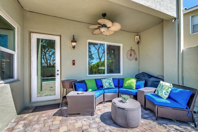 view of patio / terrace with an outdoor living space and a ceiling fan