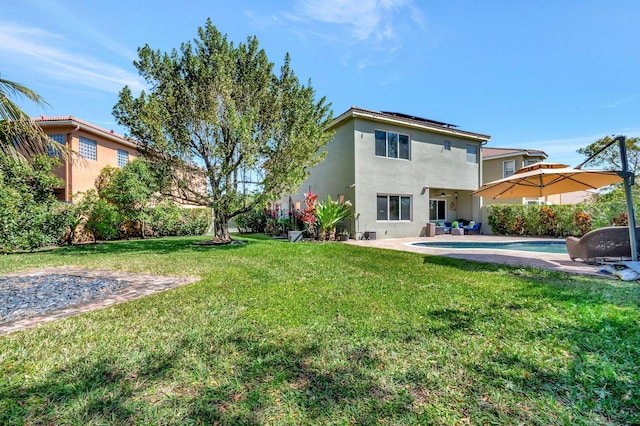 view of yard featuring an outdoor pool and a patio