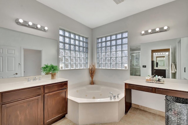 full bathroom with tile patterned flooring, a shower stall, vanity, and a whirlpool tub