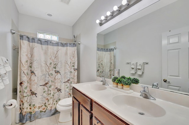 full bathroom with tile patterned flooring, a shower with shower curtain, toilet, and a sink