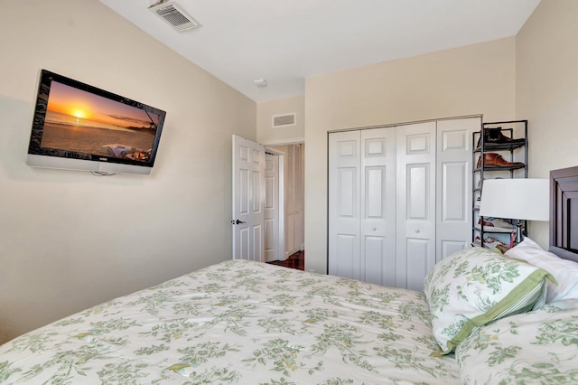 bedroom with visible vents and a closet