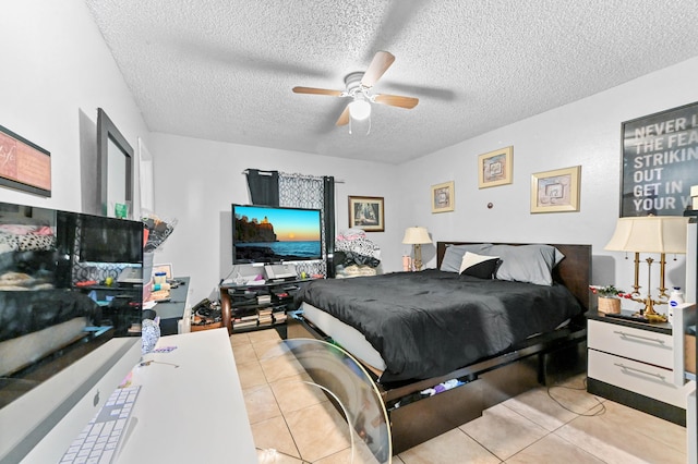 tiled bedroom featuring a textured ceiling and ceiling fan