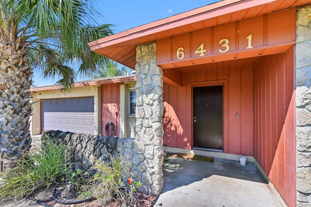 doorway to property featuring an attached garage