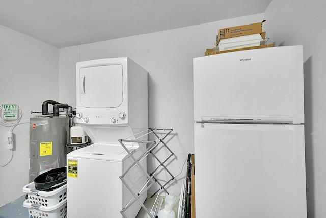 laundry room featuring stacked washer and dryer, laundry area, and electric water heater