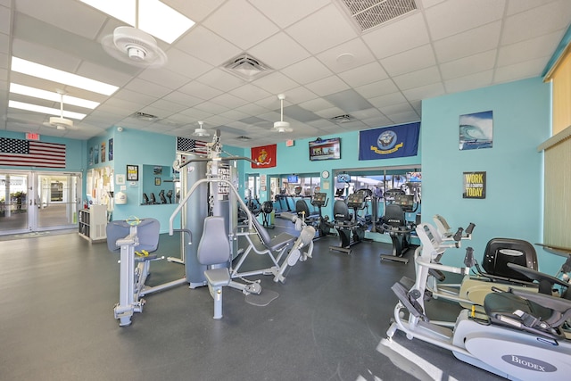 gym featuring a drop ceiling and visible vents