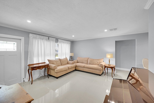 living area featuring a textured ceiling, visible vents, and recessed lighting