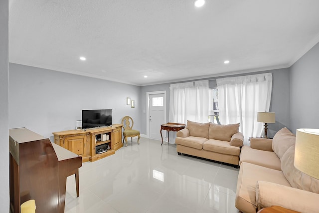 living area with light tile patterned floors, baseboards, ornamental molding, and recessed lighting