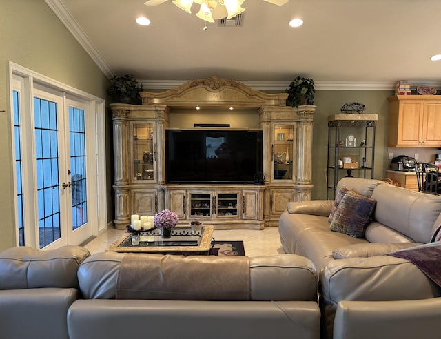 living area with light tile patterned flooring, visible vents, a ceiling fan, and ornamental molding