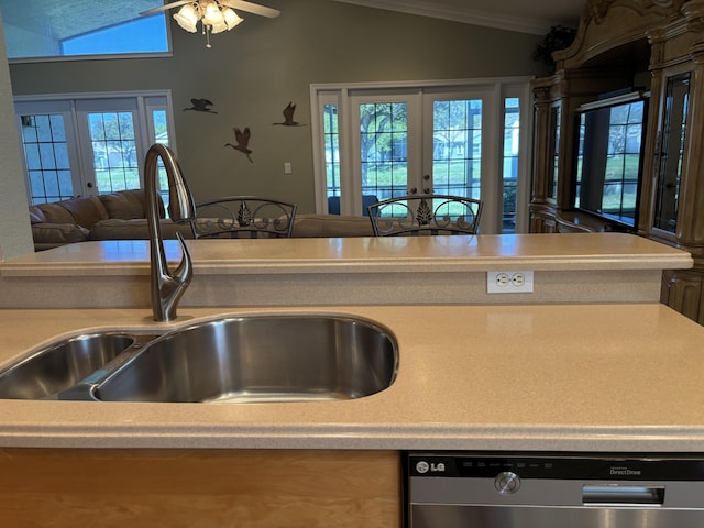 kitchen featuring a sink, french doors, lofted ceiling, and stainless steel dishwasher