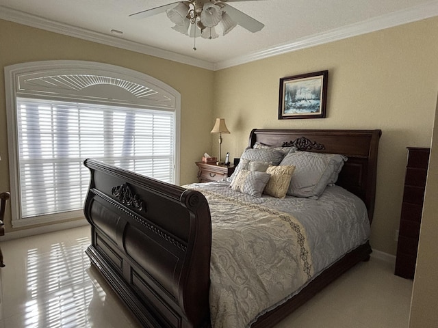 bedroom featuring a ceiling fan and ornamental molding