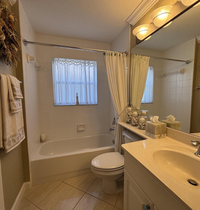 full bathroom featuring toilet, shower / tub combo with curtain, tile patterned floors, a textured ceiling, and vanity