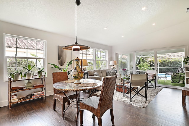 dining room with visible vents, a textured ceiling, recessed lighting, wood-type flooring, and lofted ceiling