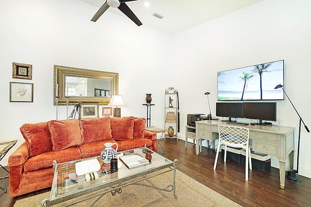 living area with wood finished floors, visible vents, and ceiling fan